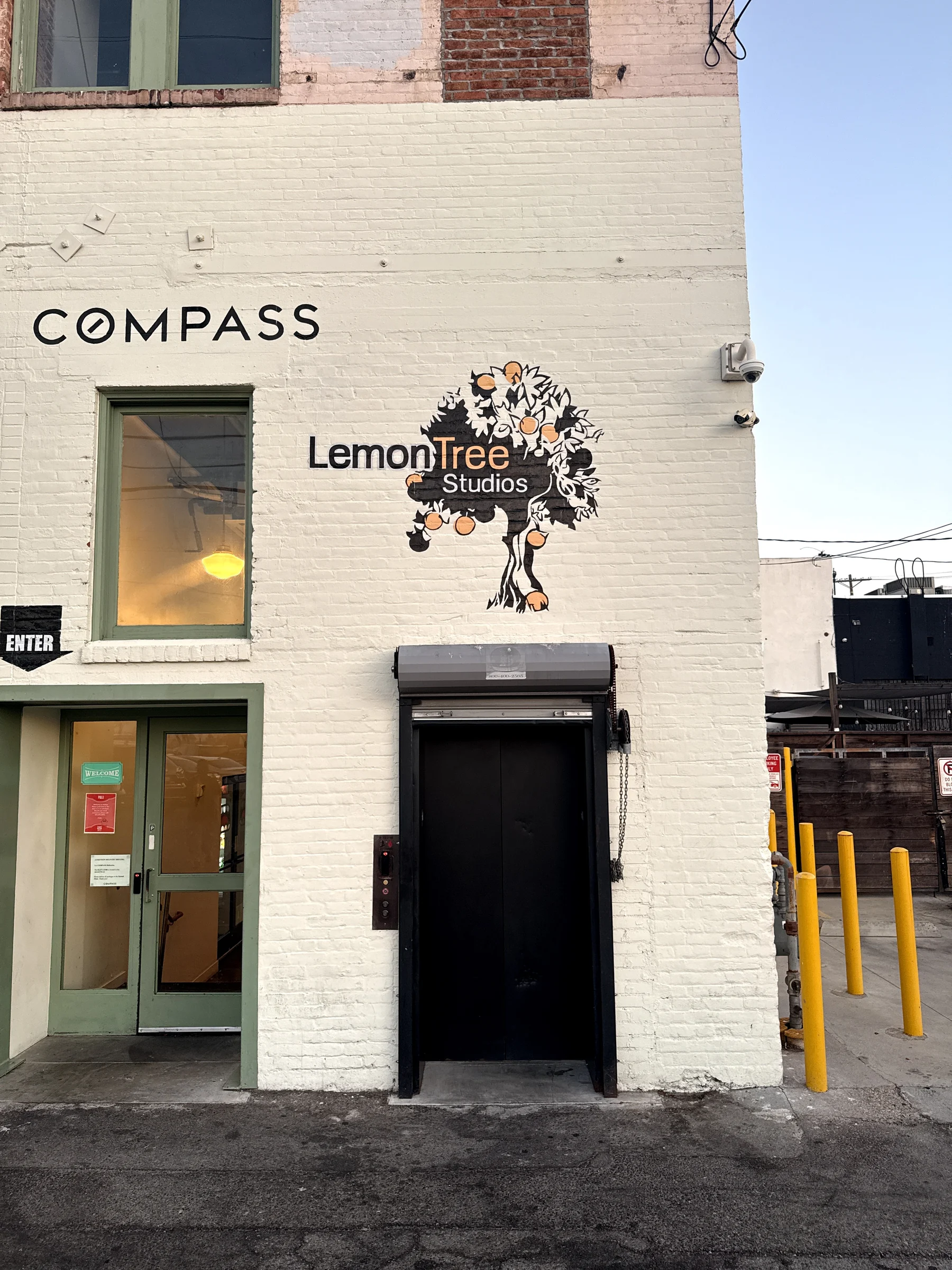 The LemonTree Studios tree logo above the Highland Park elevator entrance